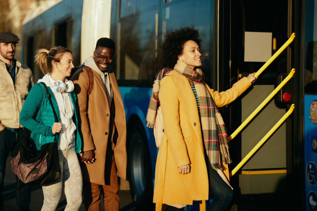 people getting on a bus