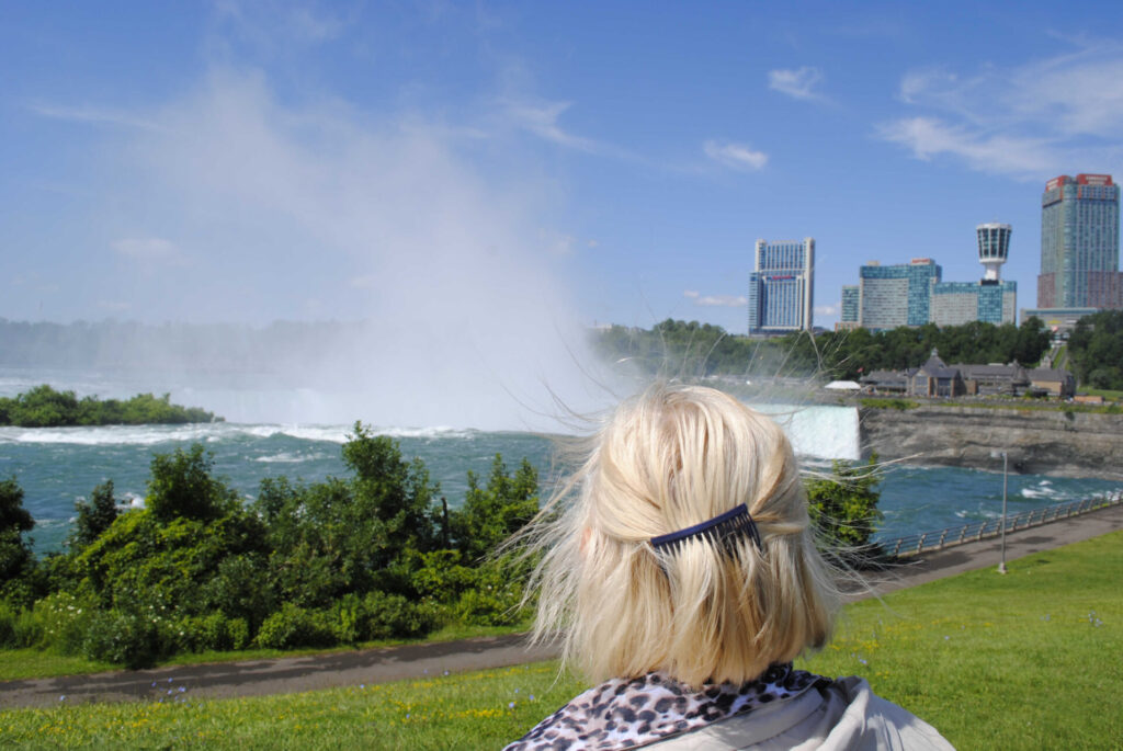 A tourist looking at Niagara Falls