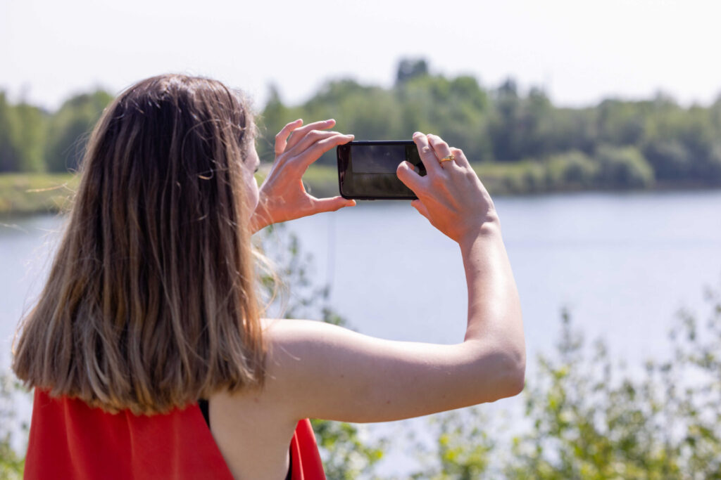 Woman taking scenic pictures
